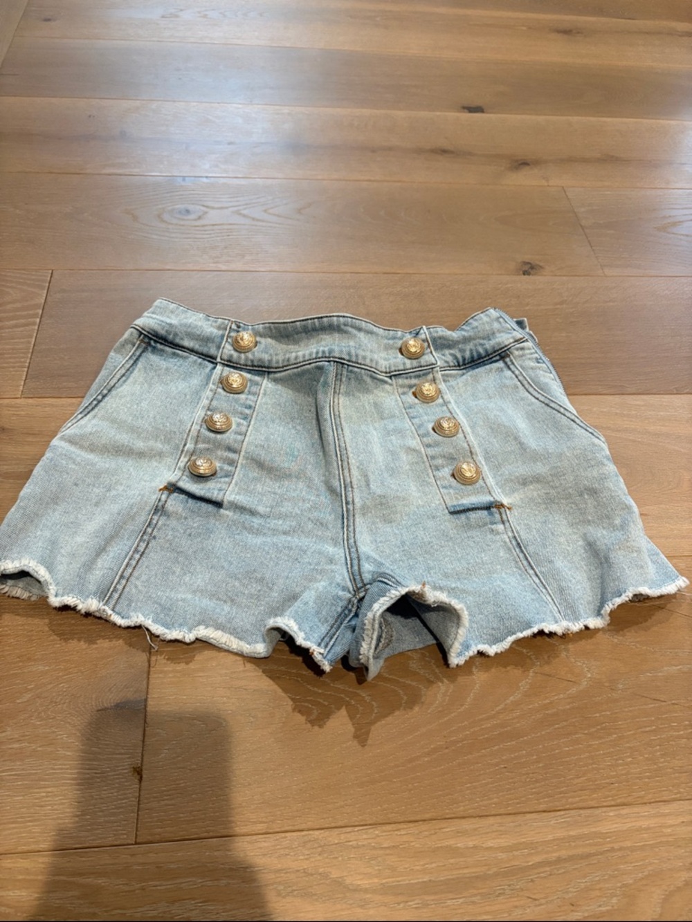 Generation Love Woman’s Size 28 Light Blue Denim Sailor-Button Shorts.
